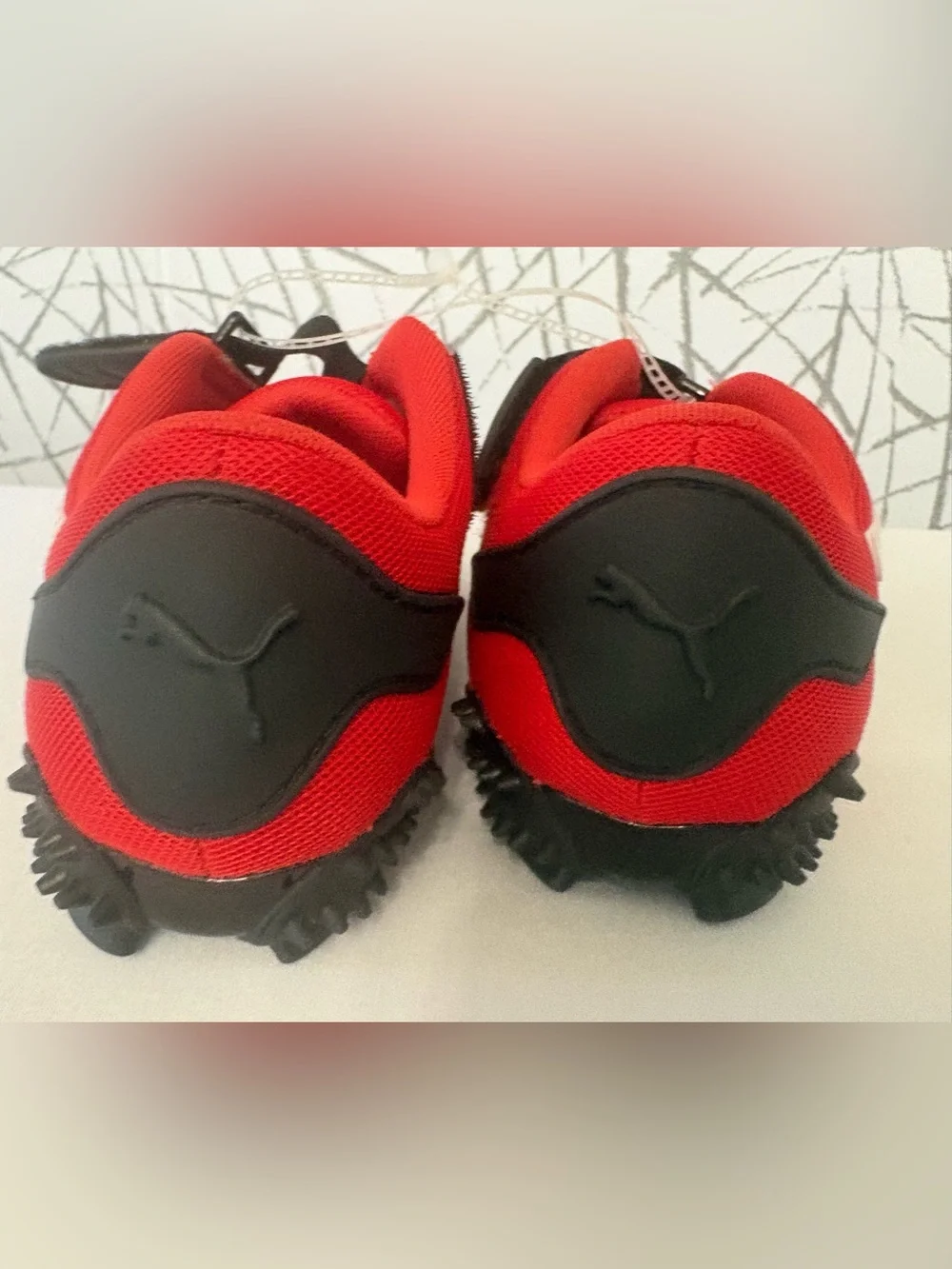 PUMA Mostro OG Sneakers. Vibrant  Red with a Unique Spike Sole.